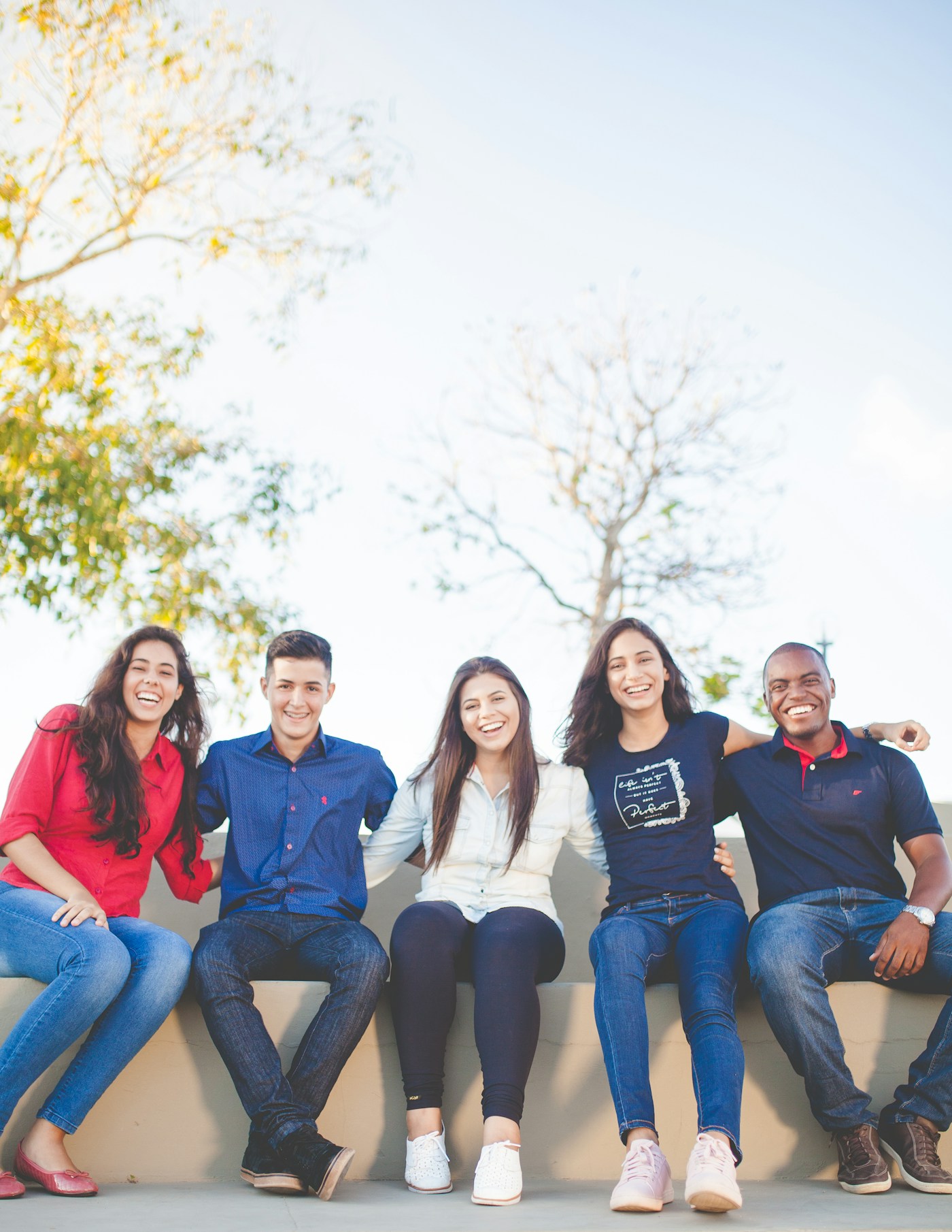 A group of young adults smiling together